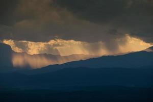 sunrise with clouds, light and rays photo