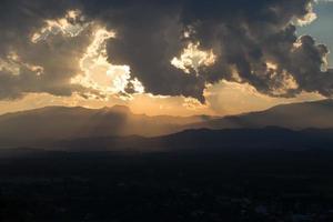 sunrise with clouds, light and rays photo