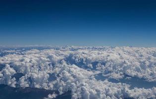 Himalaya mountains under clouds photo