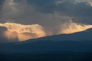 sunrise with clouds, light and rays photo