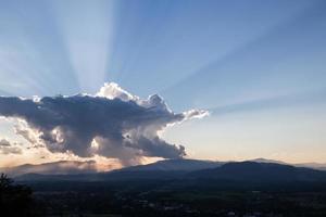 sunrise with clouds, light and rays photo