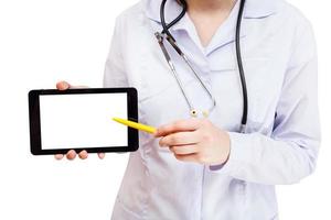 nurse points on tablet pc with blank screen photo