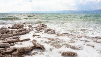 natural salt on beach of Dead Sea photo