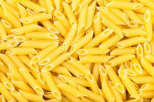 many durum wheat semolina pasta penne rigate photo