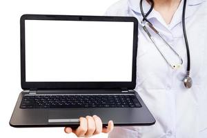 nurse holds computer laptop with blank screen photo