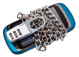 Smartphone chained and closed by combination lock photo