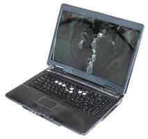 old damaged laptop isolated on white photo