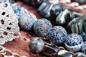 Dragon Veins Agate and hematite beads close up photo