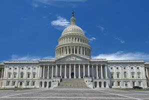 Washington Capitol on sunny cloudy sky background photo