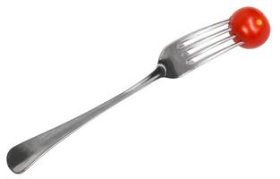 dinning fork with impaled cherry tomato photo