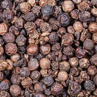 Black pepper peppercorns close up photo