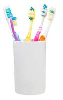 five toothbrushes in ceramic glass photo