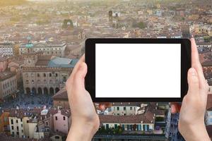 tourist photographs main square in Bologna city photo