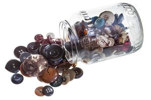 glass jar with clothes buttons photo