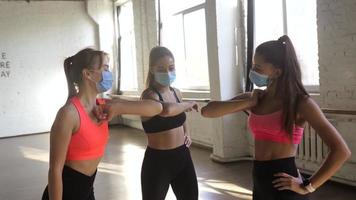 Fitness girls motivate each other in workout session video