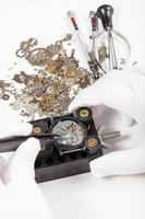 repair of mechanic watch with spare parts photo