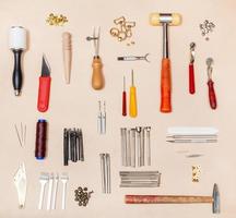 collection various leather crafting tools photo