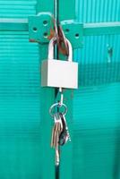 green door locked with padlock photo