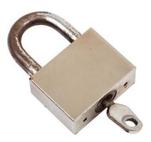 closed steel old padlock with key isolated photo