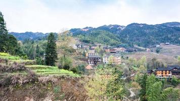 view of Tiantouzhai village in terraced fields photo