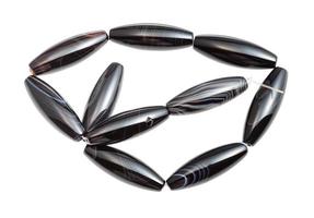 tangled string from black polished agate beads photo