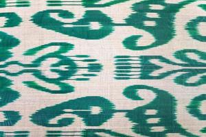 central asian green pattern on silk fabric photo