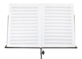 blank double pages of music book on stand close up photo
