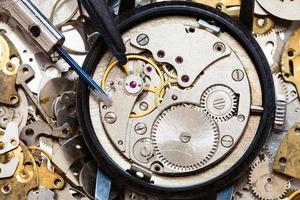 top view of tools on clockwork on spare parts photo