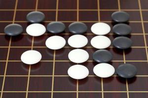 many stones during go game playing on goban photo
