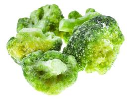 several frozen broccoli isolated on white photo