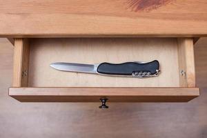 foldable knife in open drawer photo