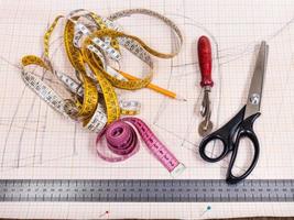 cutting table with pattern and tailoring tools photo