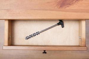 one latchkey in open drawer photo