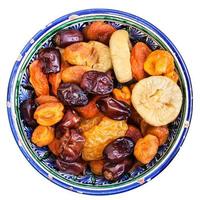 above view of dried fruits in bowl isolated photo