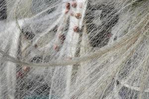 Fishing net hanging for drying photo