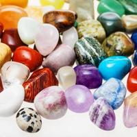 many tumbled natural mineral gemstones photo