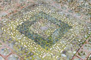 old cobblestones and pebbles pavement in Taormina photo