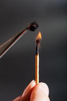 match flame ignites cotton fibers photo