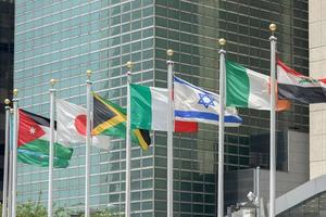 flags outside united nations building in new york photo