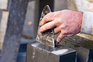 Old retired man hands working slate photo