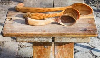 traditional rustic carved wooden spoons photo