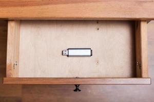 one flash drive in open drawer photo