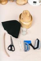 felt hood, wooden hat-block, tools for hatmaking photo