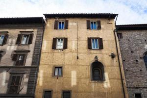 facades of old apartment buildings in Florence photo