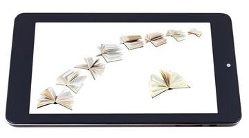 flying books on display of tablet pc isolated photo