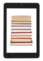stack of books on screen of tablet pc isolated photo