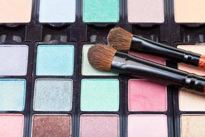makeup kit and cosmetic brushes photo