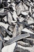 many old used asphalt pieces close up photo