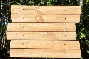 empty outdoor wooden billboard in park photo