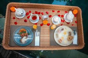 Romantic Floating Breakfast on private pool at Villa in Bali. photo